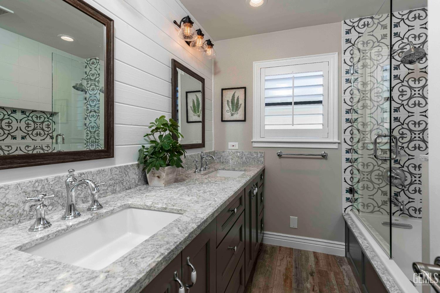 Undisclosed Address Bakersfield, CA 93314 - Photo 41 of 49 a bathroom with a granite countertop sink and a mirror