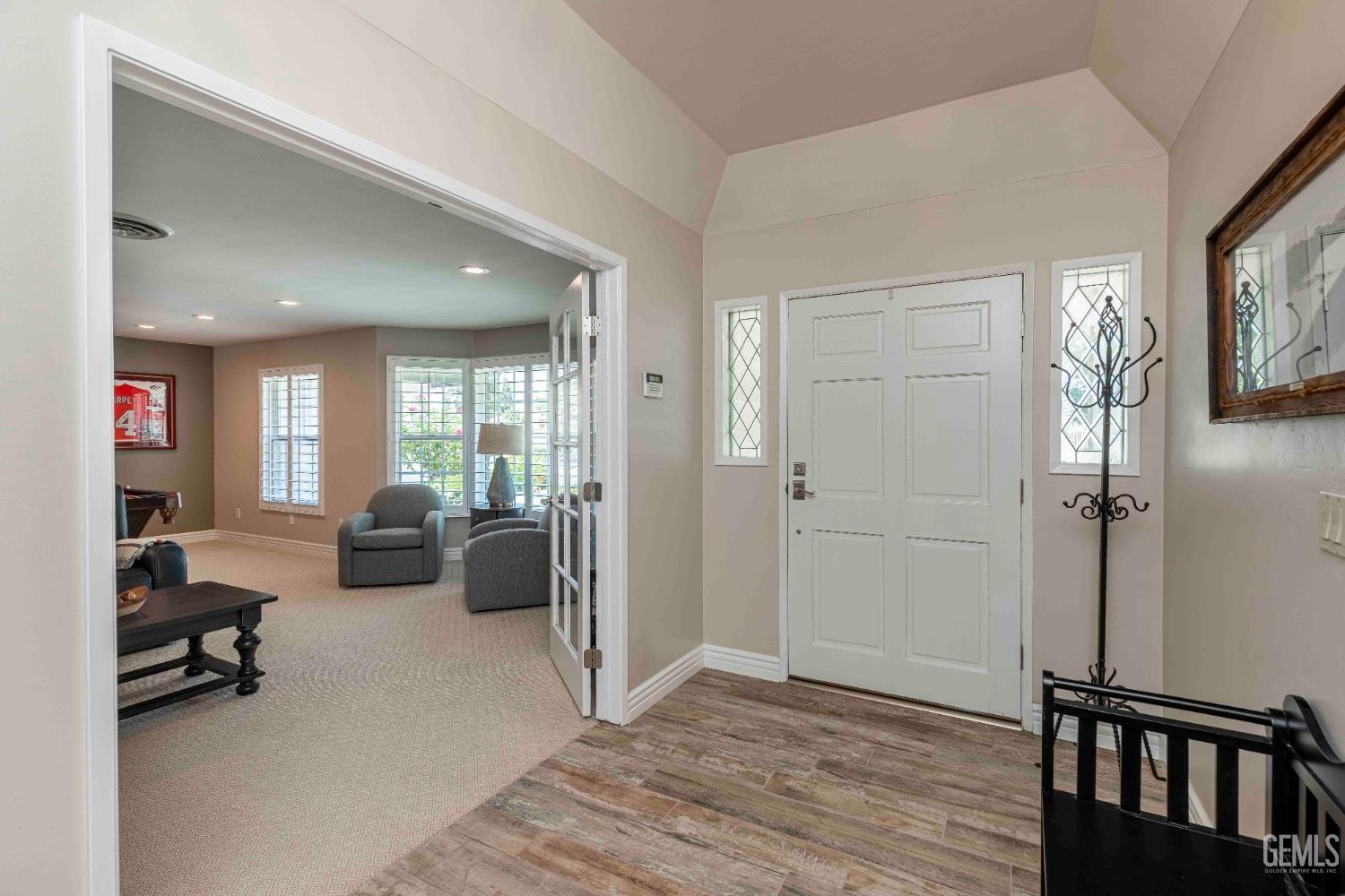 Undisclosed Address Bakersfield, CA 93314 - Photo 6 of 49 a living room with furniture and a flat screen tv