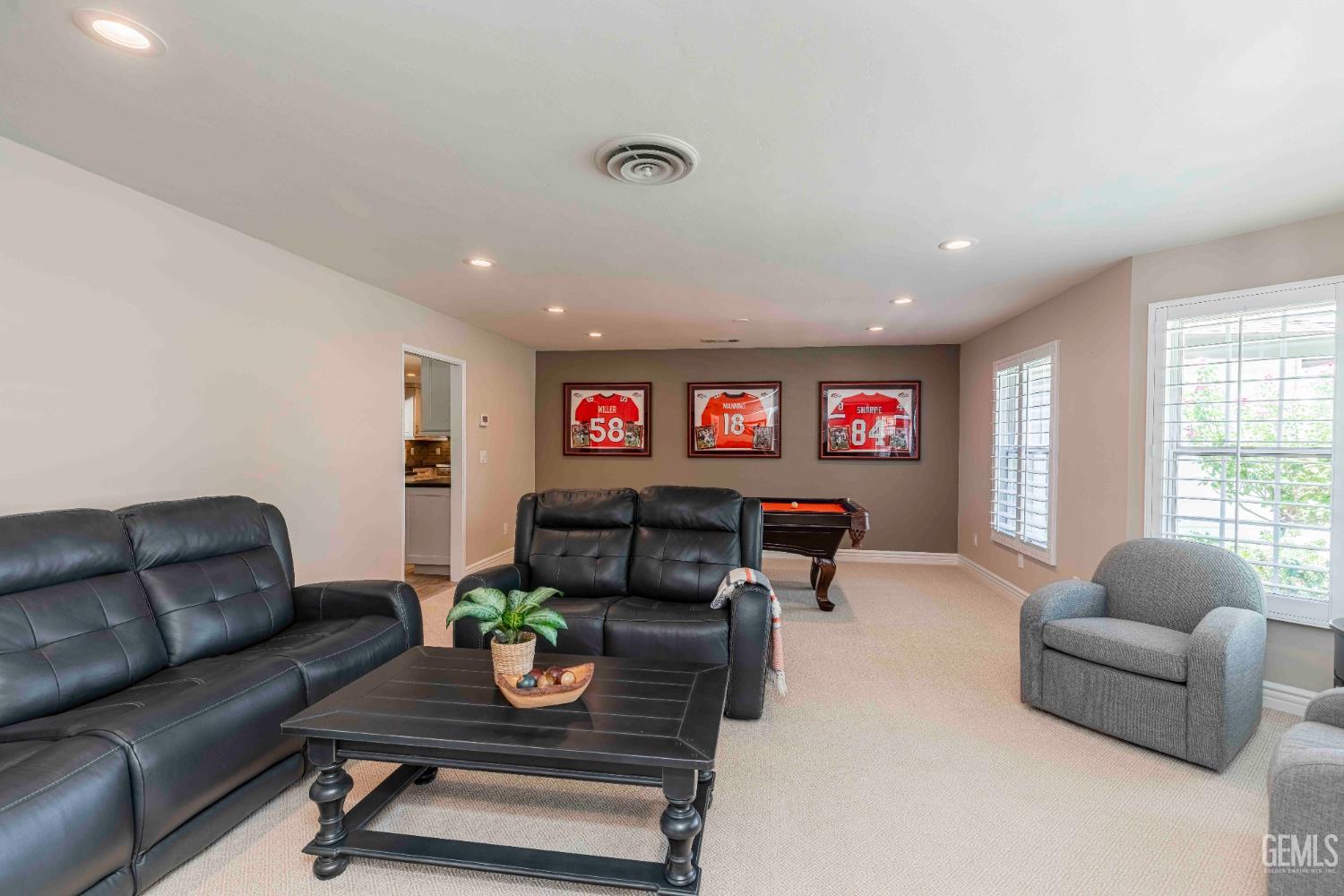 Undisclosed Address Bakersfield, CA 93314 - Photo 8 of 49 a living room with furniture and a flat screen tv