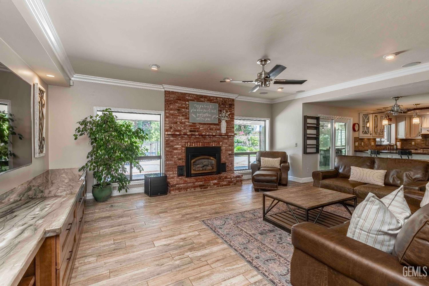 Undisclosed Address Bakersfield, CA 93314 - Photo 9 of 49 a living room with furniture and a fireplace