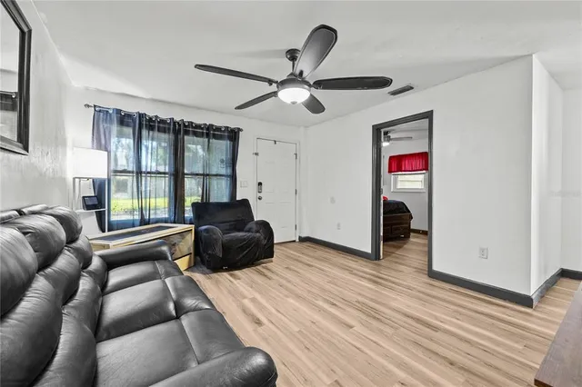a living room with furniture and a window