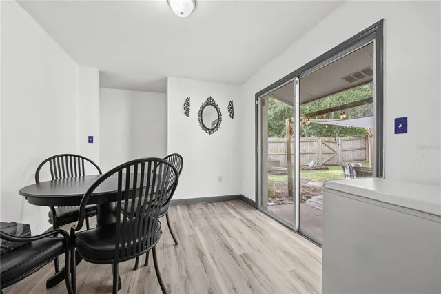 a view of a livingroom with furniture window and wooden floor