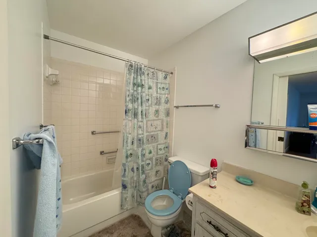 a view of a patio with table and chairs and potted plants