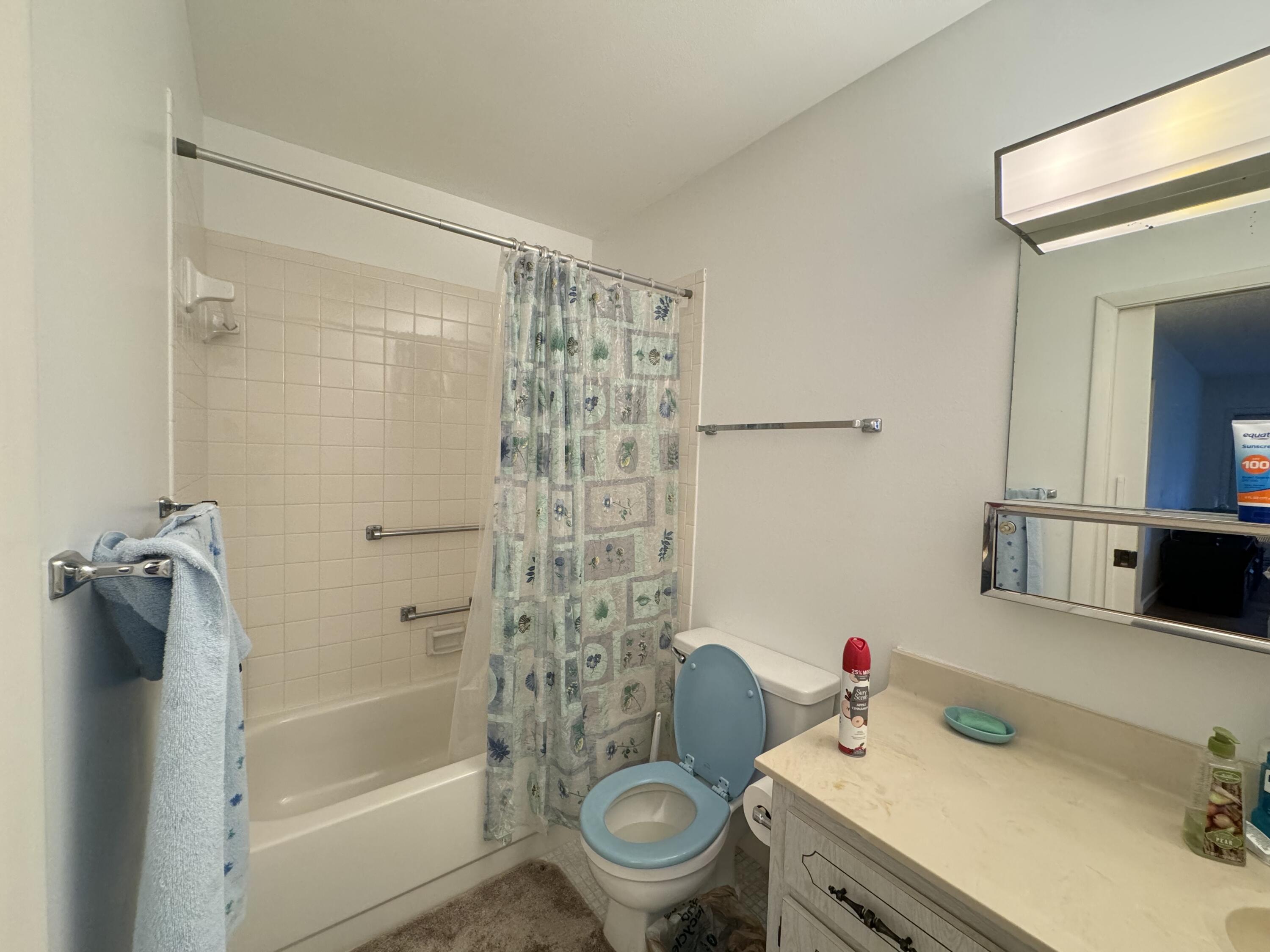 4675 Northwest 3rd Court, Unit B Delray Beach, FL 33445 - Photo 16 of 28 a bathroom with a sink toilet and shower
