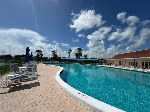 a view of a patio with couches table and chairs