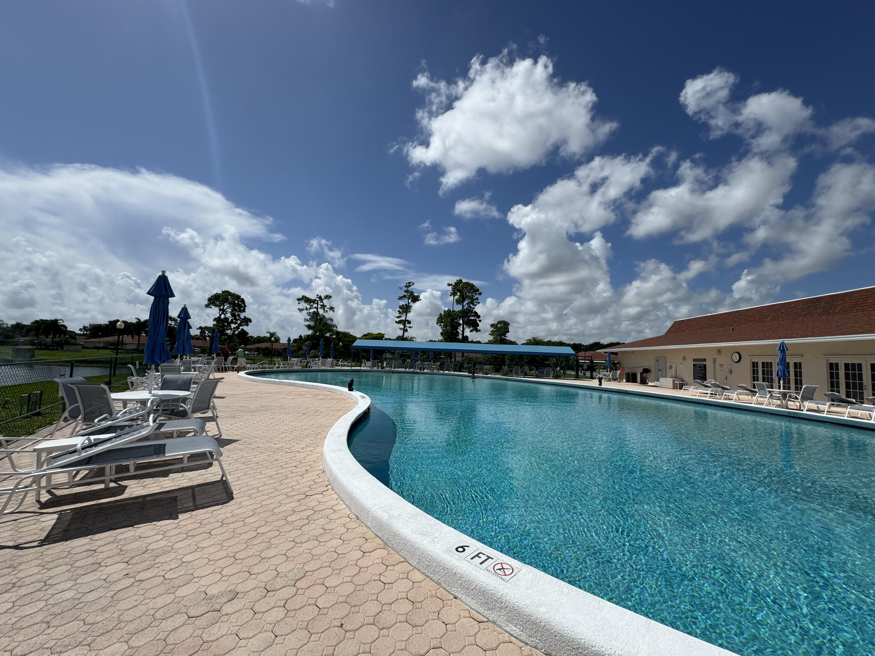 4675 Northwest 3rd Court, Unit B Delray Beach, FL 33445 - Photo 18 of 28 a view of a lake with a terrace