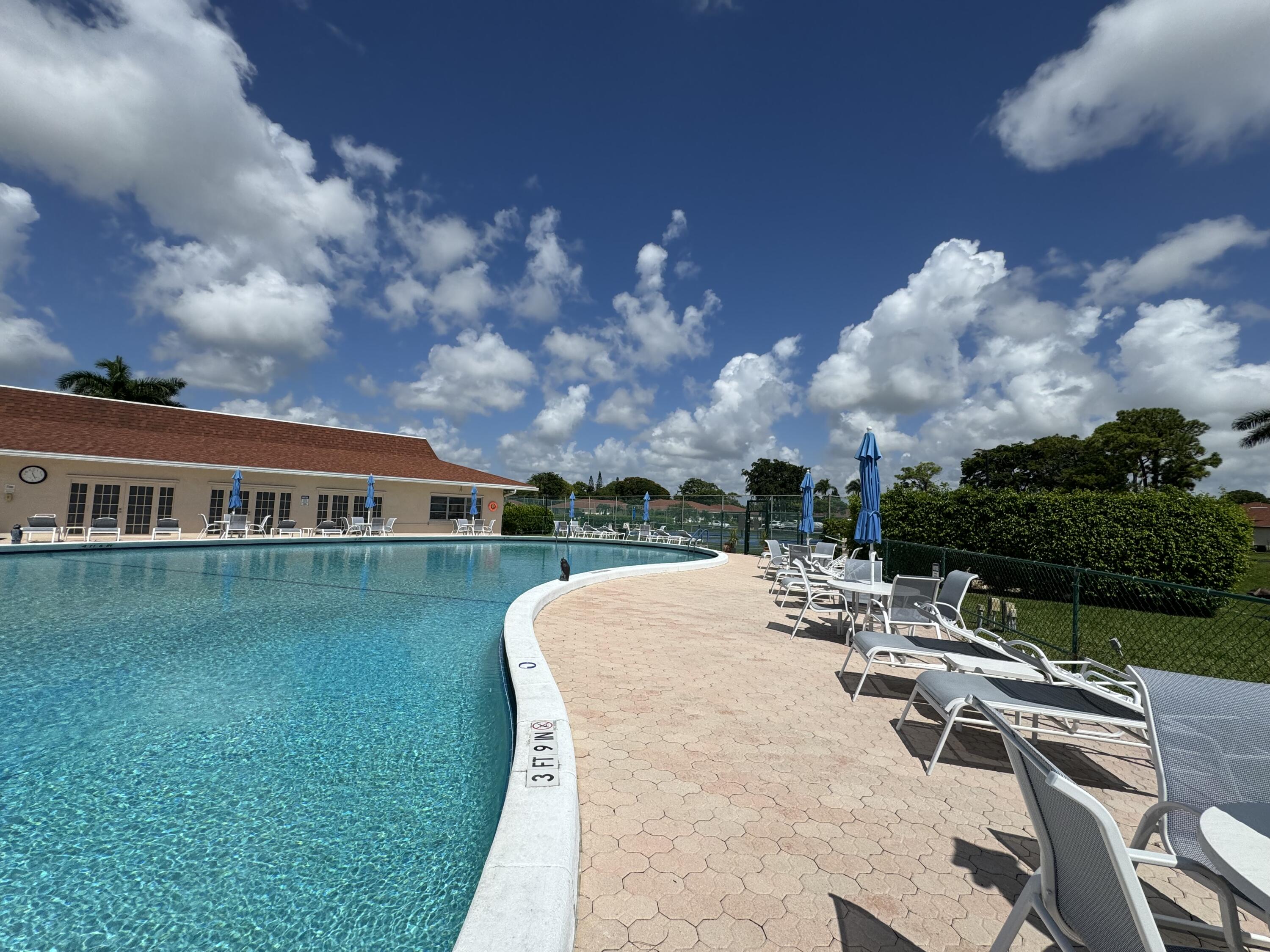 4675 Northwest 3rd Court, Unit B Delray Beach, FL 33445 - Photo 21 of 28 a view of a house with backyard porch and garden