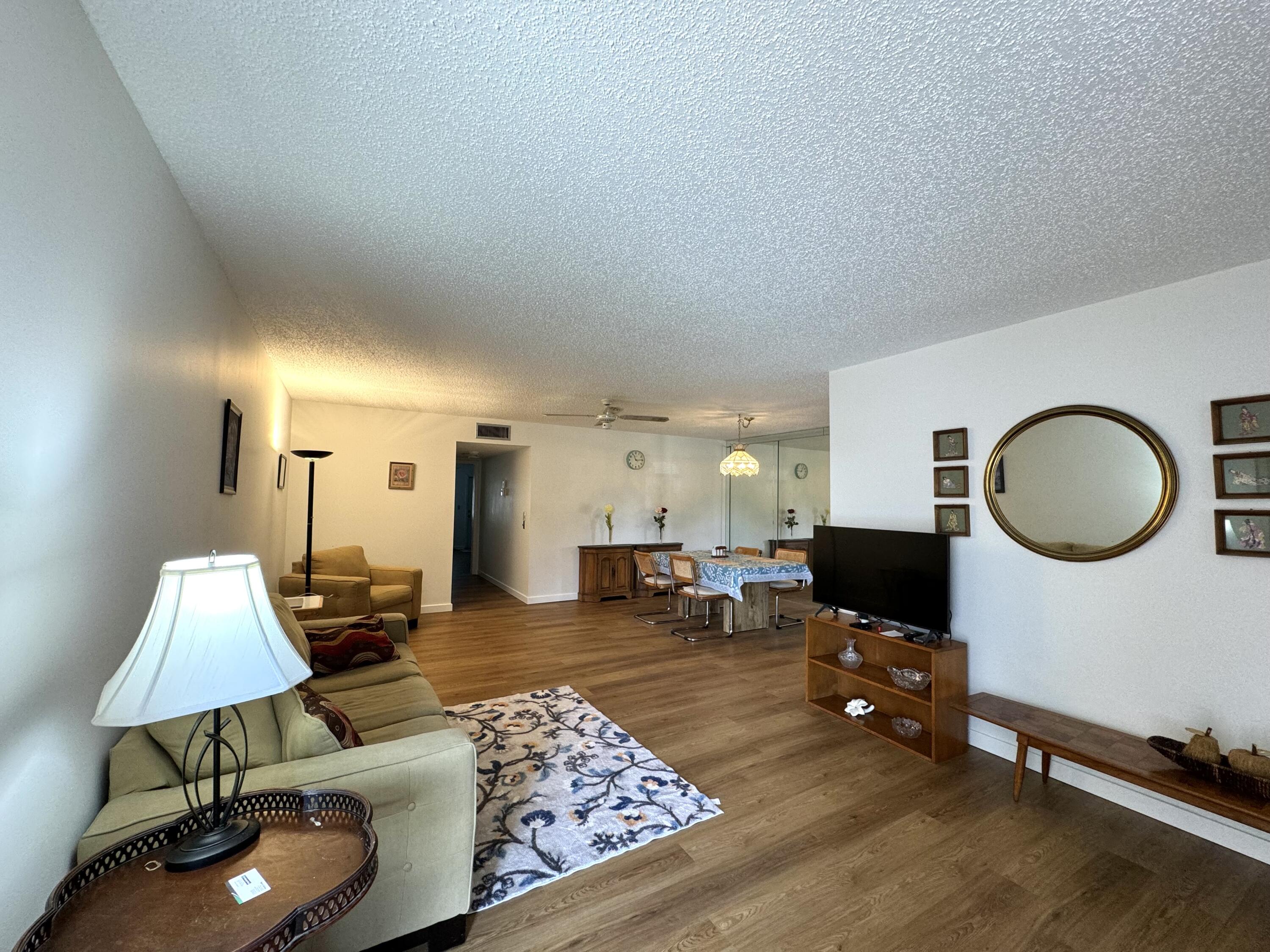 4675 Northwest 3rd Court, Unit B Delray Beach, FL 33445 - Photo 5 of 28 a living room with furniture and wooden floor