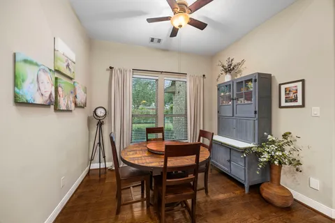 a dining room with furniture and window