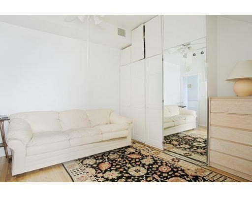 1003 Chestnut Street, Unit 1003 Newton, MA 02464 - Photo 12 of 28 a living room with a couch and a coffee table
