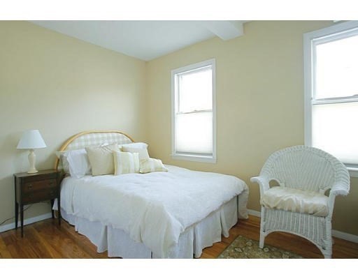 1003 Chestnut Street, Unit 1003 Newton, MA 02464 - Photo 14 of 28 a bedroom with a bed and window