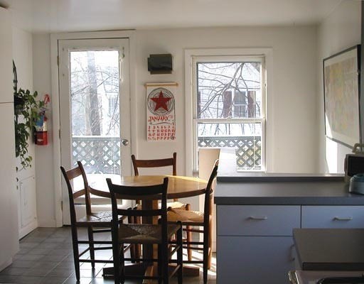 1003 Chestnut Street, Unit 1003 Newton, MA 02464 - Photo 5 of 28 a view of a dining room with furniture and window
