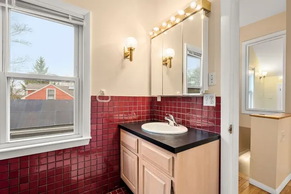 a bathroom with a sink and a mirror