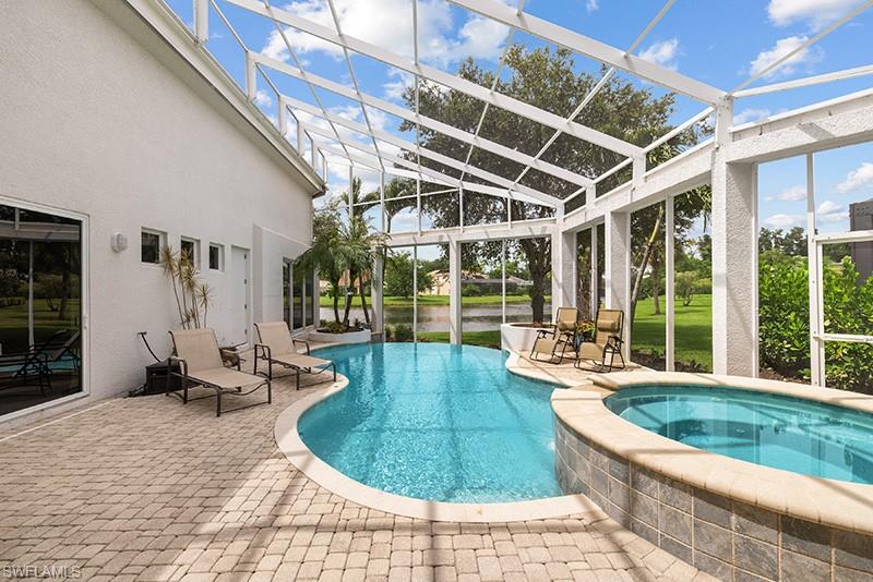 433 Crestwood Road Naples, FL 34113 - Photo 2 of 50 Infinity Pool view overlooks creek