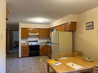 a kitchen with a refrigerator stove and sink