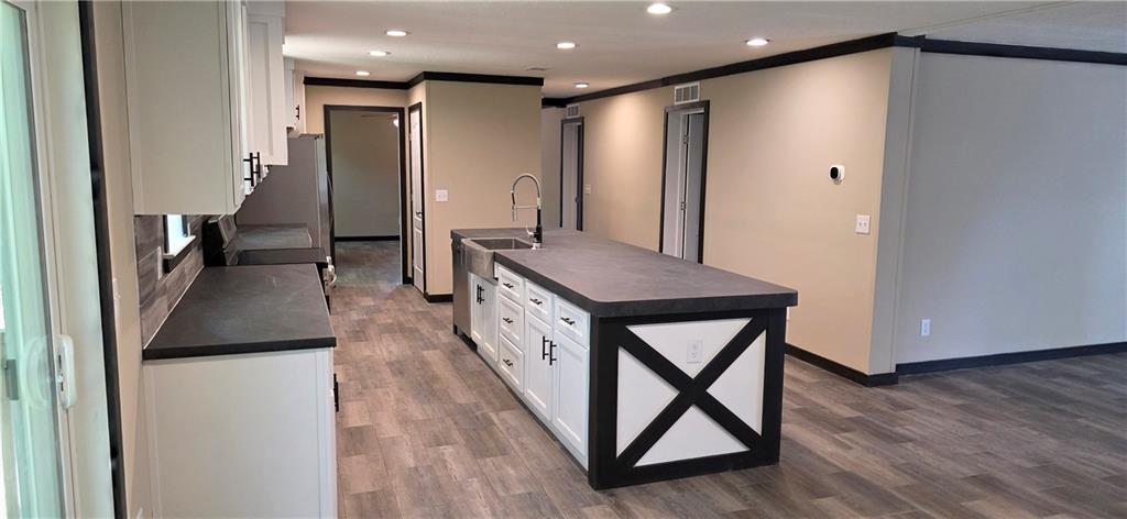 3457 Jerusalem Church Road Jasper, GA 30143 - Photo 14 of 17 a kitchen with stainless steel appliances granite countertop a refrigerator a stove and a wooden floors