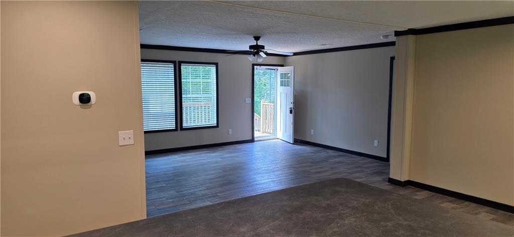 3457 Jerusalem Church Road Jasper, GA 30143 - Photo 15 of 17 an empty room with wooden floor and windows