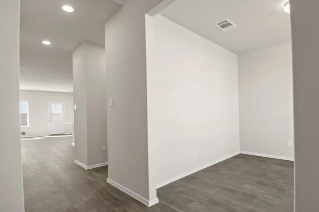 a view of a livingroom with wooden floor