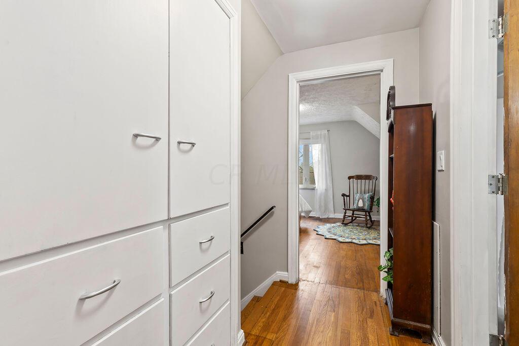2584 Chester Road Columbus, OH 43221 - Photo 33 of 49 Built in linen closet and hall to 3rd bedroom