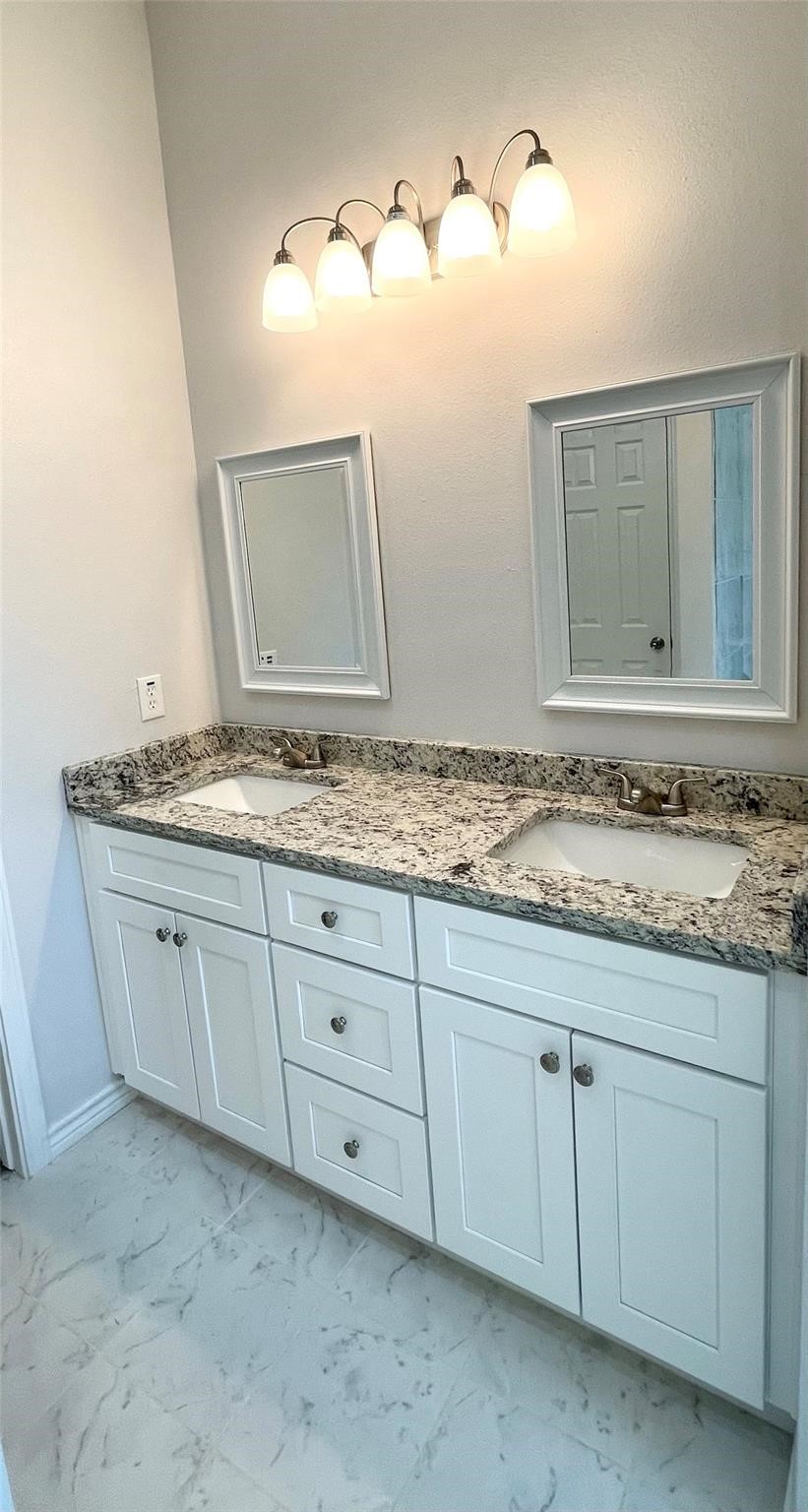 2352 Cedar Place Drive Conroe, TX 77306 - Photo 11 of 26 a bathroom with a granite countertop sink and mirror