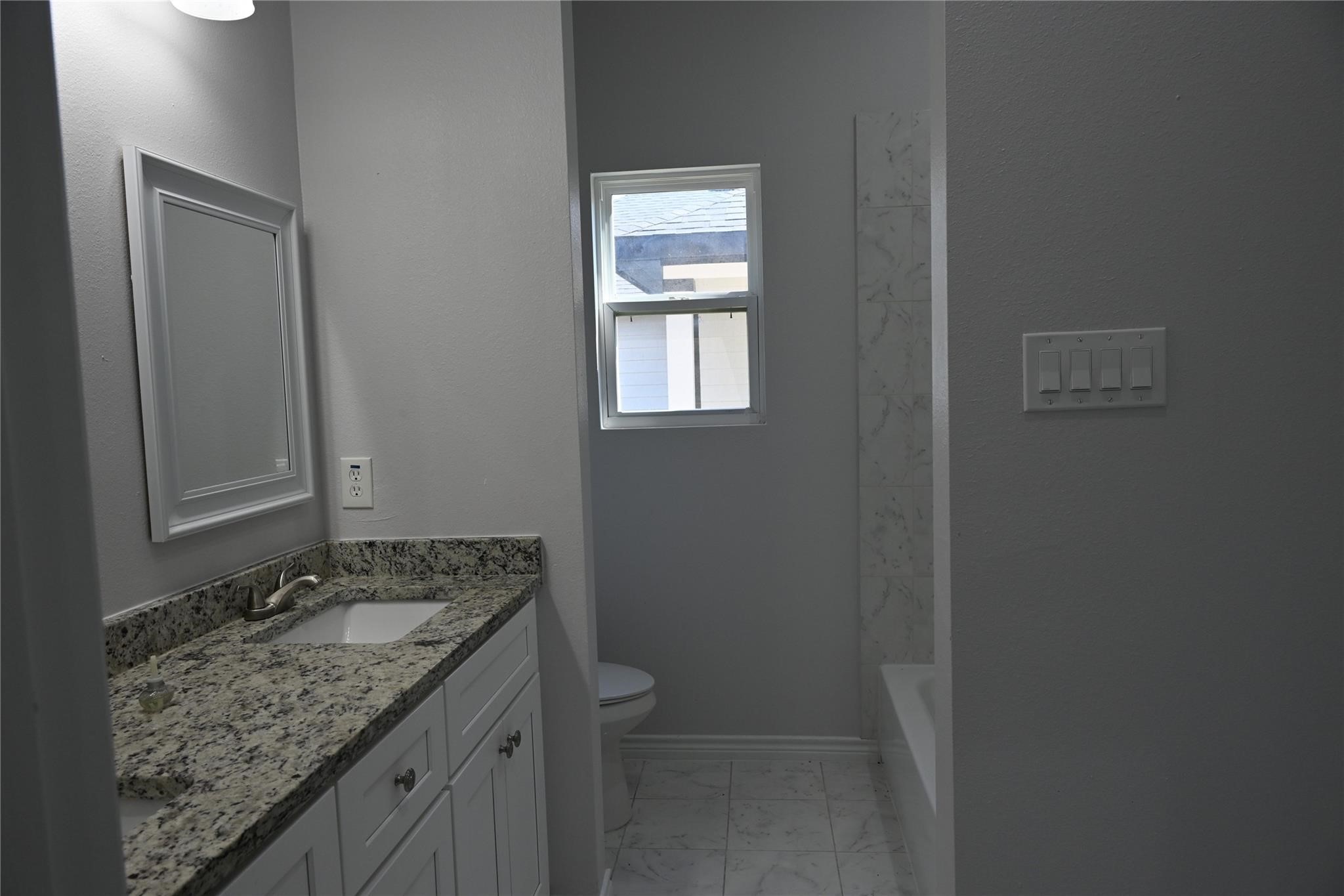 2352 Cedar Place Drive Conroe, TX 77306 - Photo 14 of 26 a bathroom with a granite countertop sink and a vanity