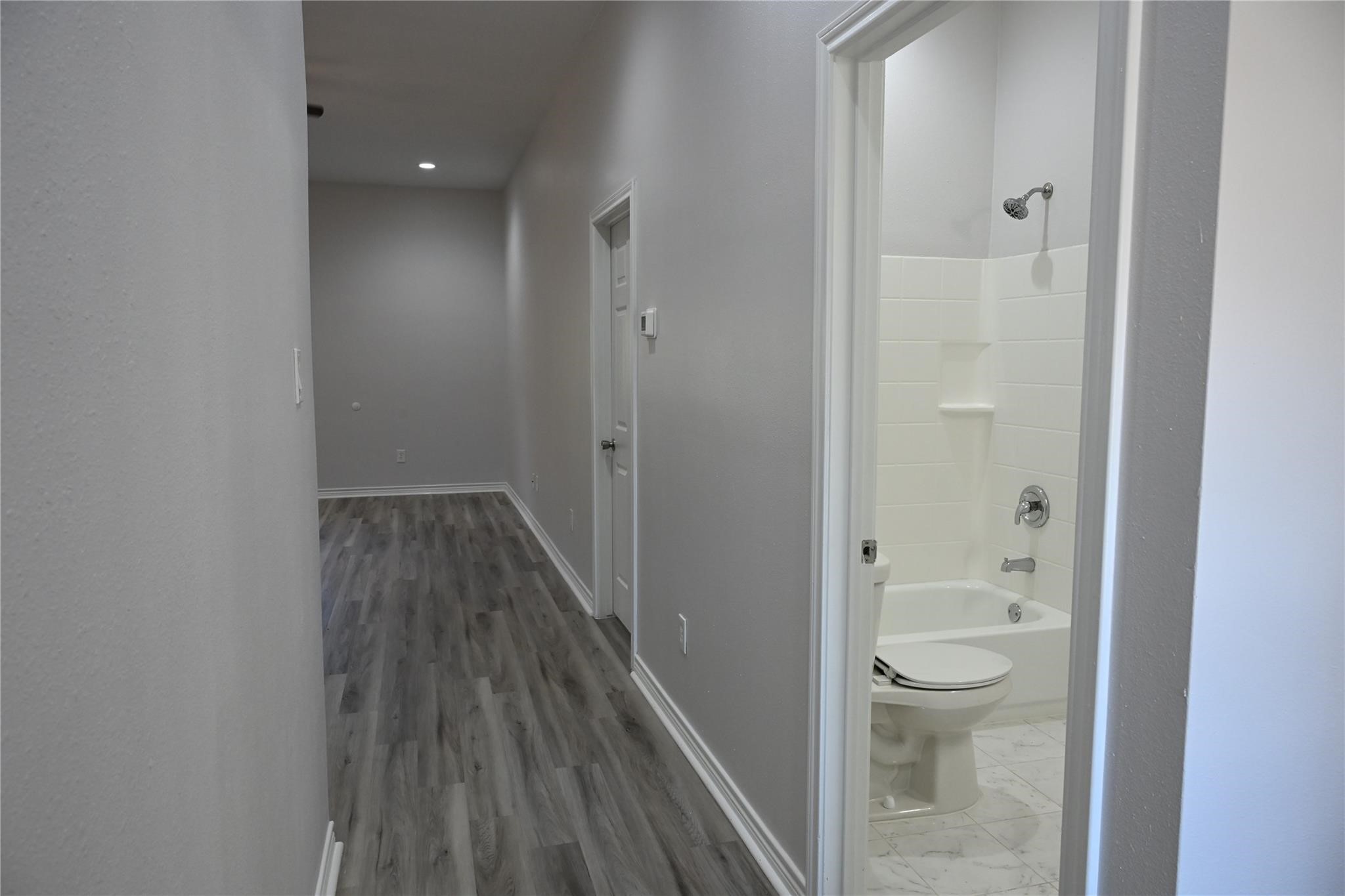 2352 Cedar Place Drive Conroe, TX 77306 - Photo 18 of 26 a bathroom with a shower toilet and a sink