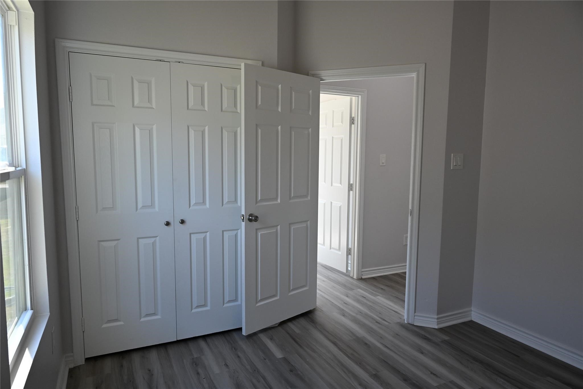 2352 Cedar Place Drive Conroe, TX 77306 - Photo 20 of 26 a view of a hallway with wooden floor