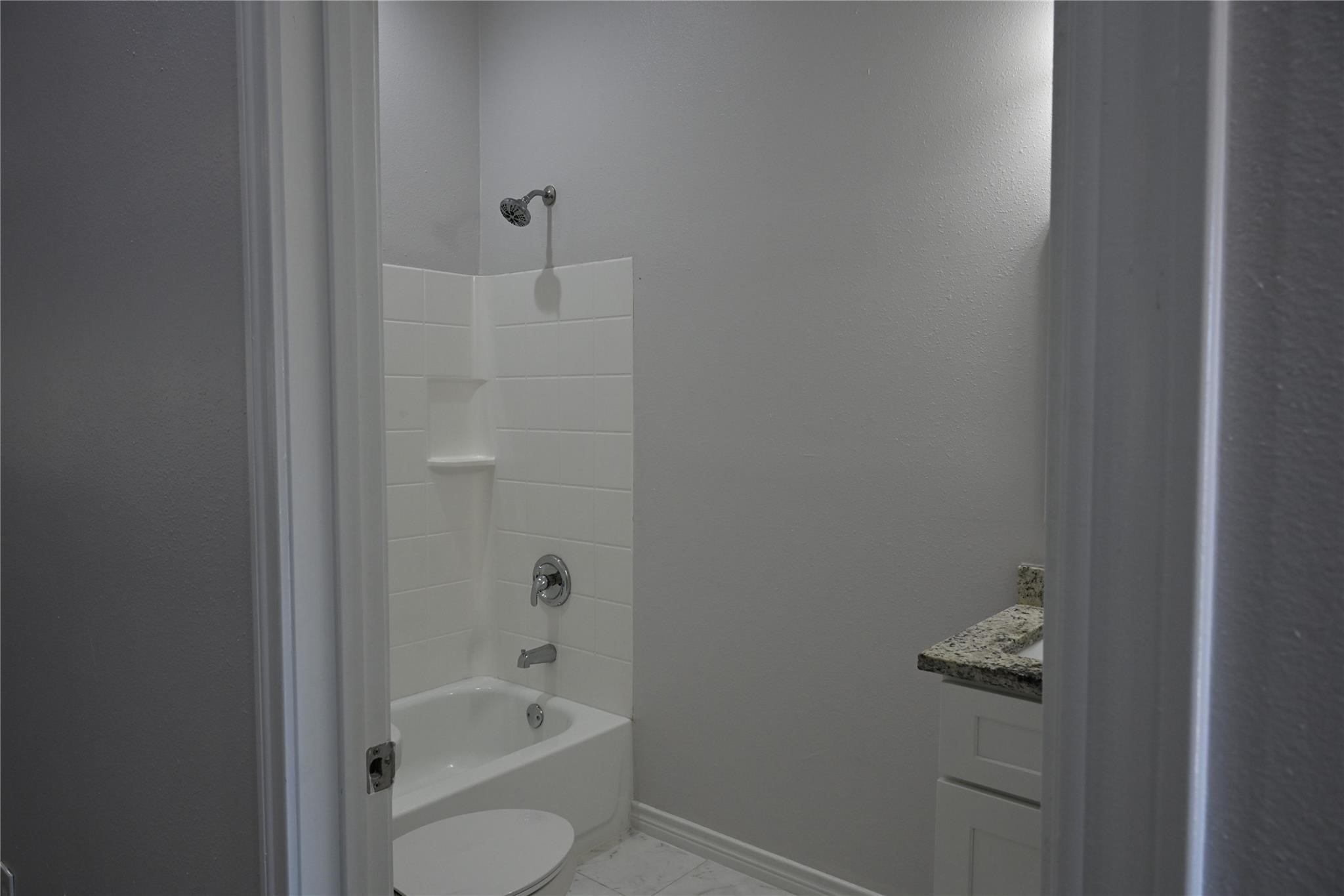 2352 Cedar Place Drive Conroe, TX 77306 - Photo 21 of 26 a bathroom with a tub
