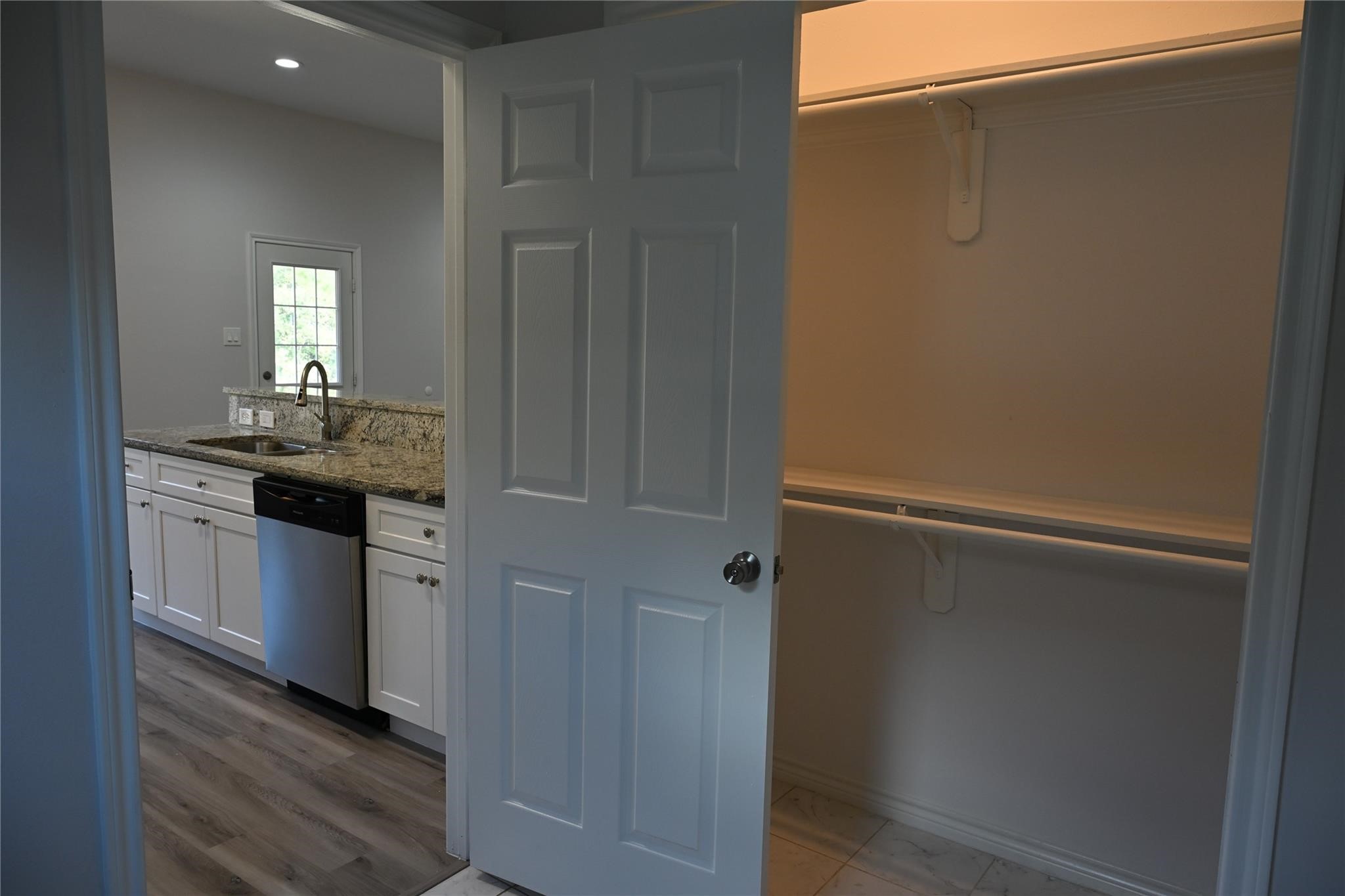 2352 Cedar Place Drive Conroe, TX 77306 - Photo 23 of 26 a kitchen with a sink and refrigerator