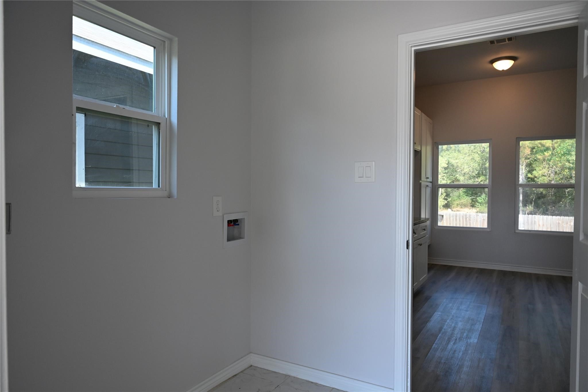 2352 Cedar Place Drive Conroe, TX 77306 - Photo 24 of 26 a view of an empty room with wooden floor and a window