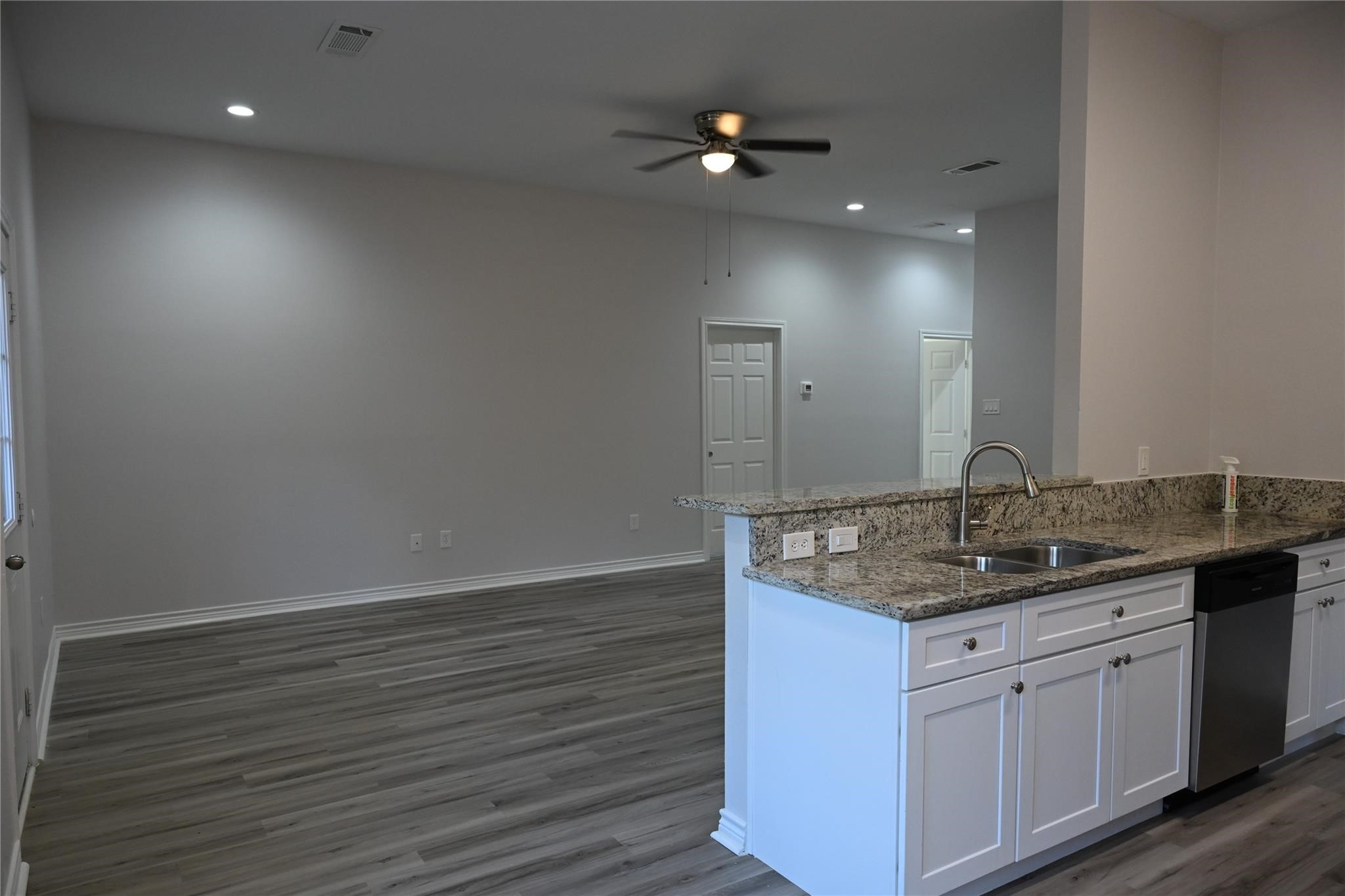 2352 Cedar Place Drive Conroe, TX 77306 - Photo 6 of 26 a bathroom with a granite countertop sink a toilet and a mirror