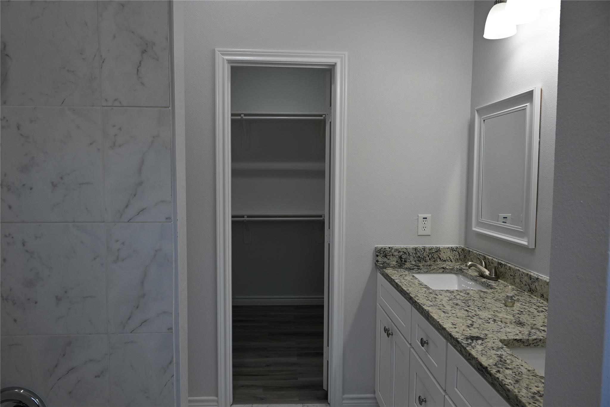 2352 Cedar Place Drive Conroe, TX 77306 - Photo 10 of 26 a bathroom with a granite countertop sink and a mirror