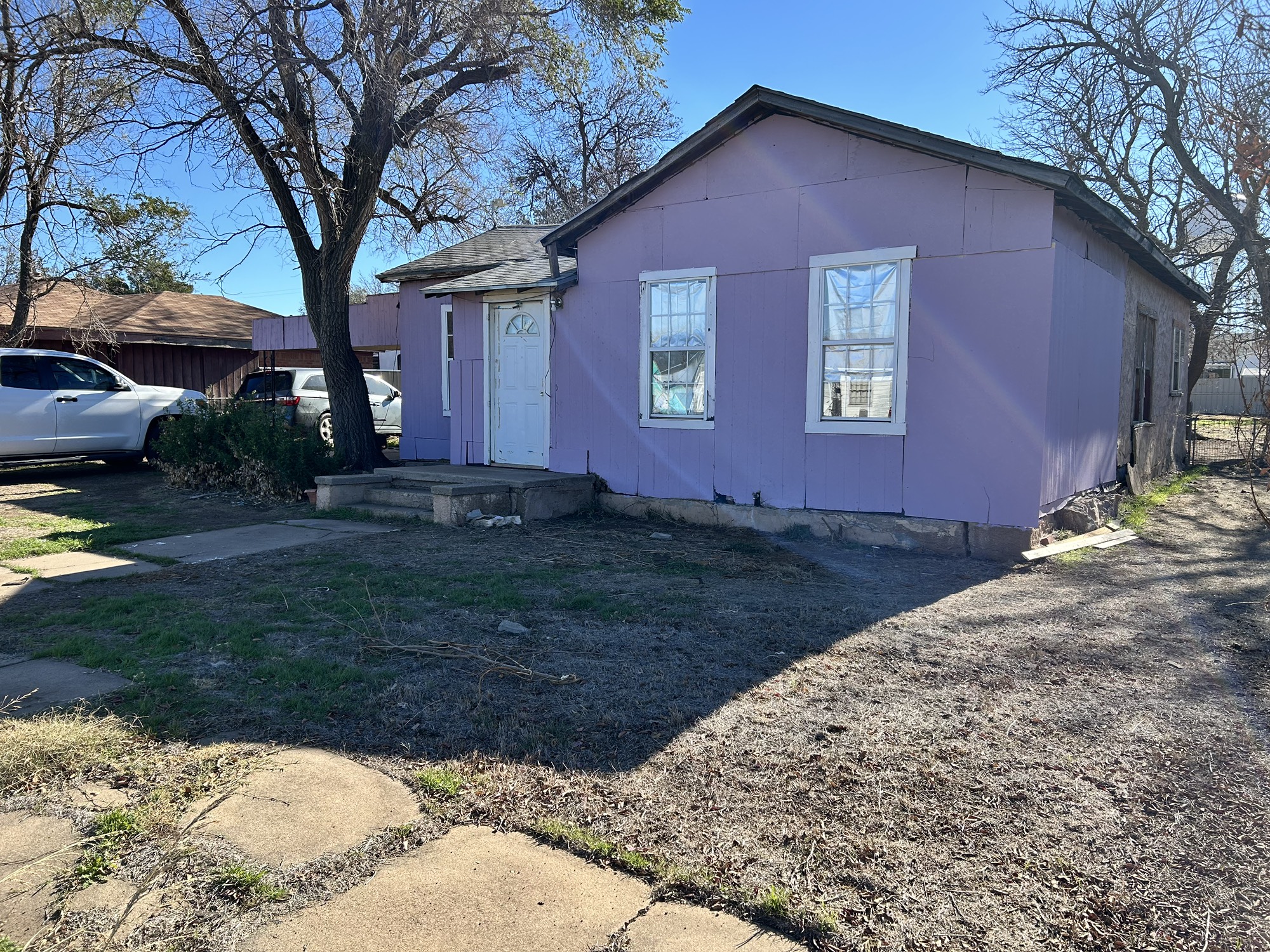 a house view with a backyard space