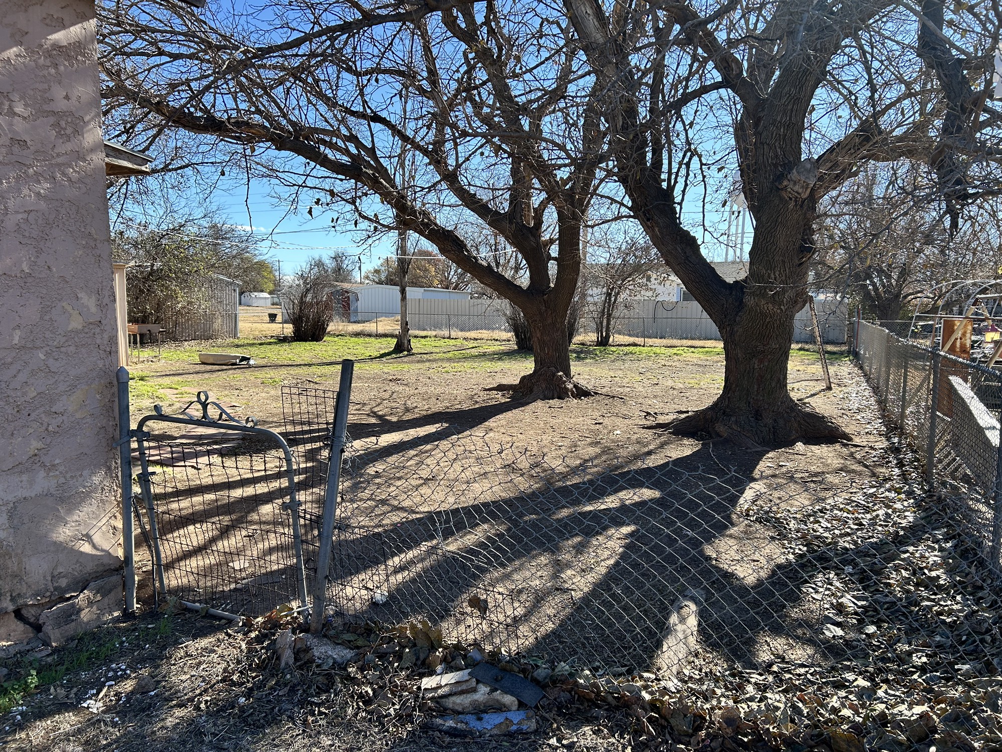 903 West 8th Street Quanah, TX 79252 - Photo 15 of 15 a view of a yard with wooden fence