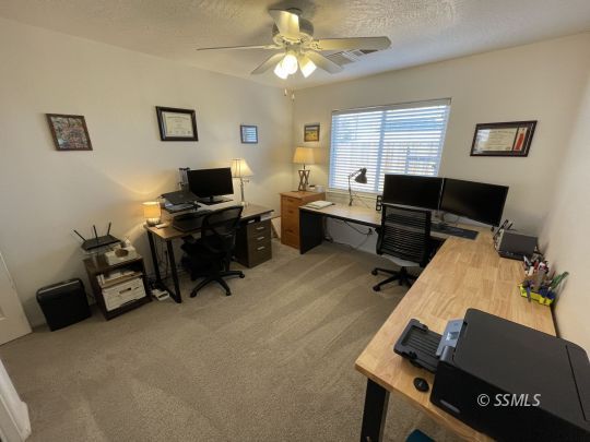 1411 Sims Street Ridgecrest, CA 93555 - Photo 16 of 35 a view of a workspace with a window