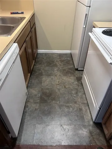 a view of a storage and utility room with a sink