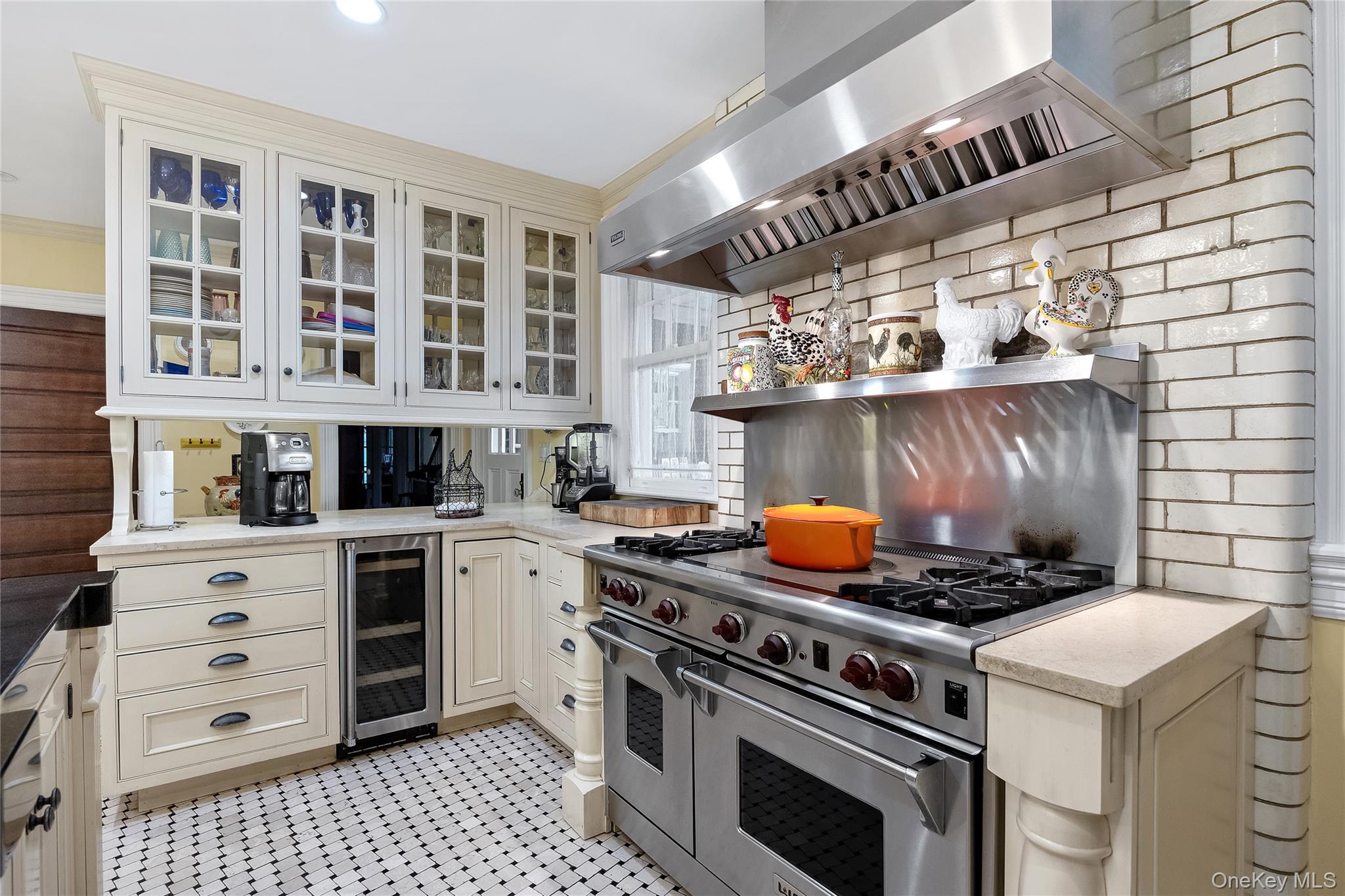 1-27 Beverly Road Queens, NY 11363 - Photo 30 of 46 a kitchen with a stove and a cabinet
