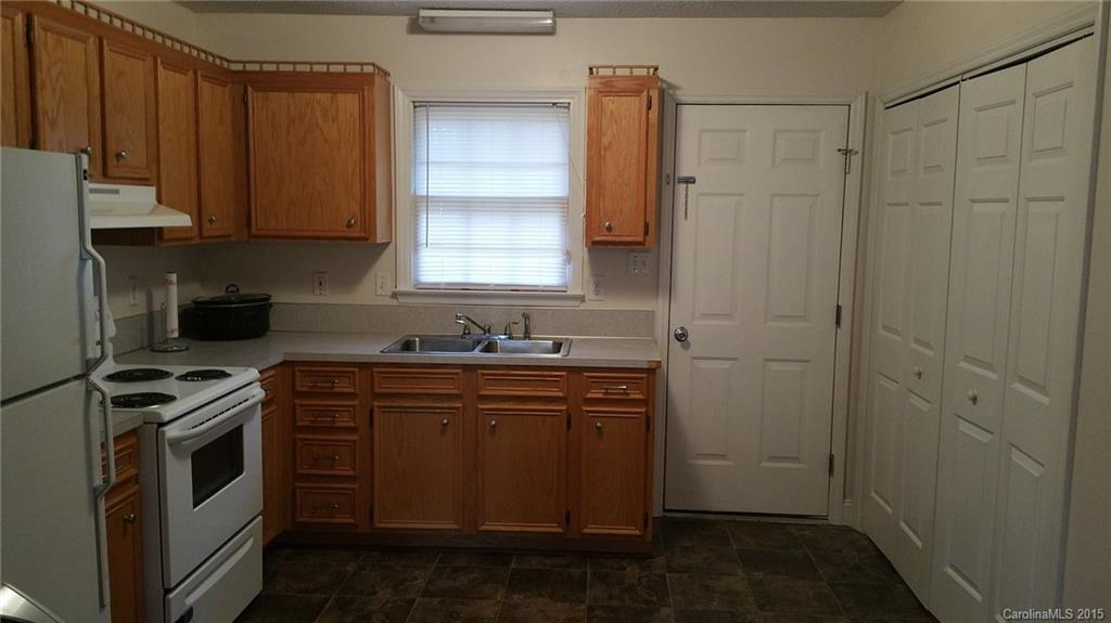 2294 Beth Haven Church Road, Unit 2294 Denver, NC 28037 - Photo 2 of 11 a kitchen with a sink stove and cabinets