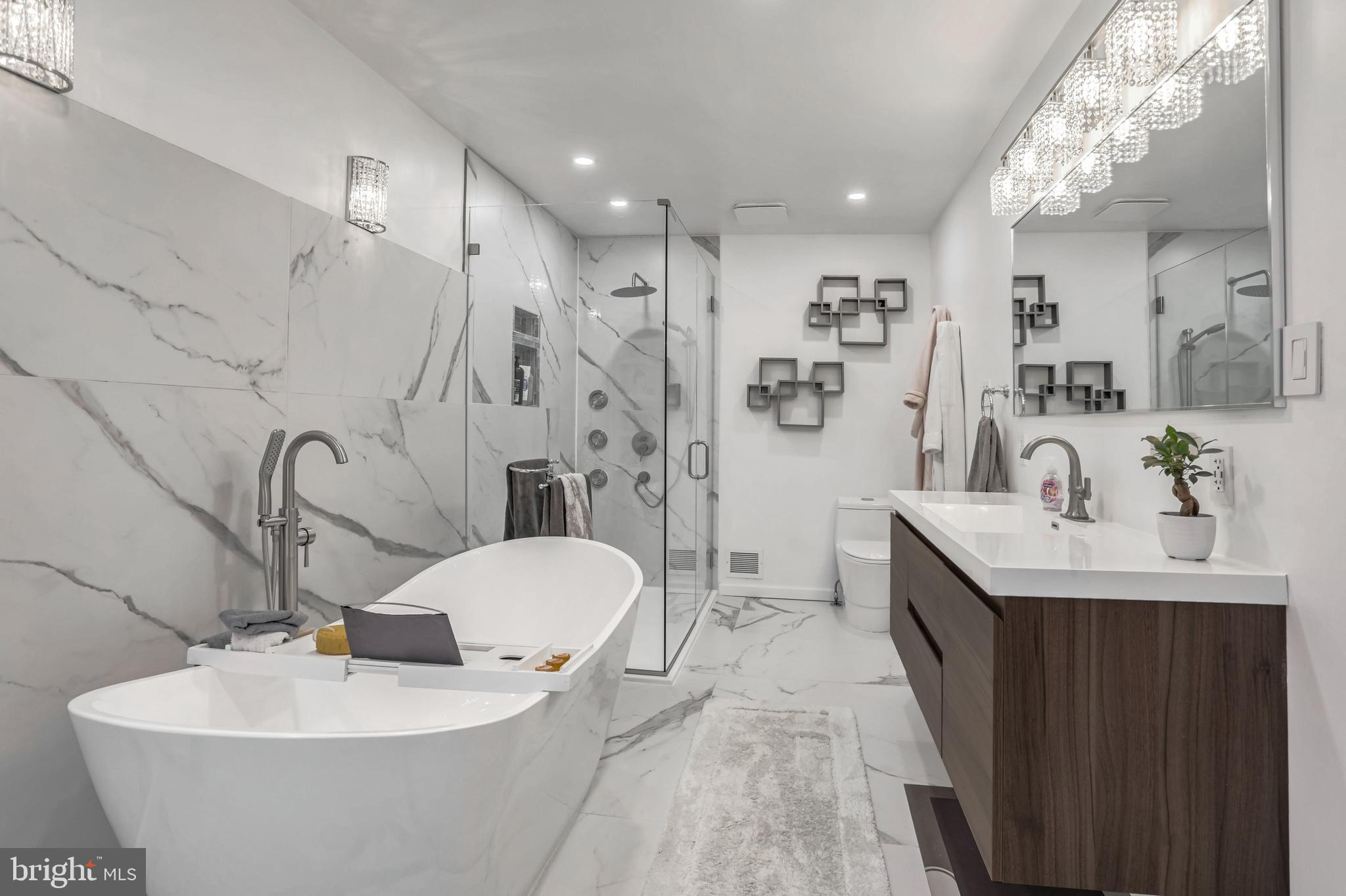 10914 Hunt Club Road Reston, VA 20190 - Photo 16 of 44 a spacious bathroom with a sink mirror and a bathtub