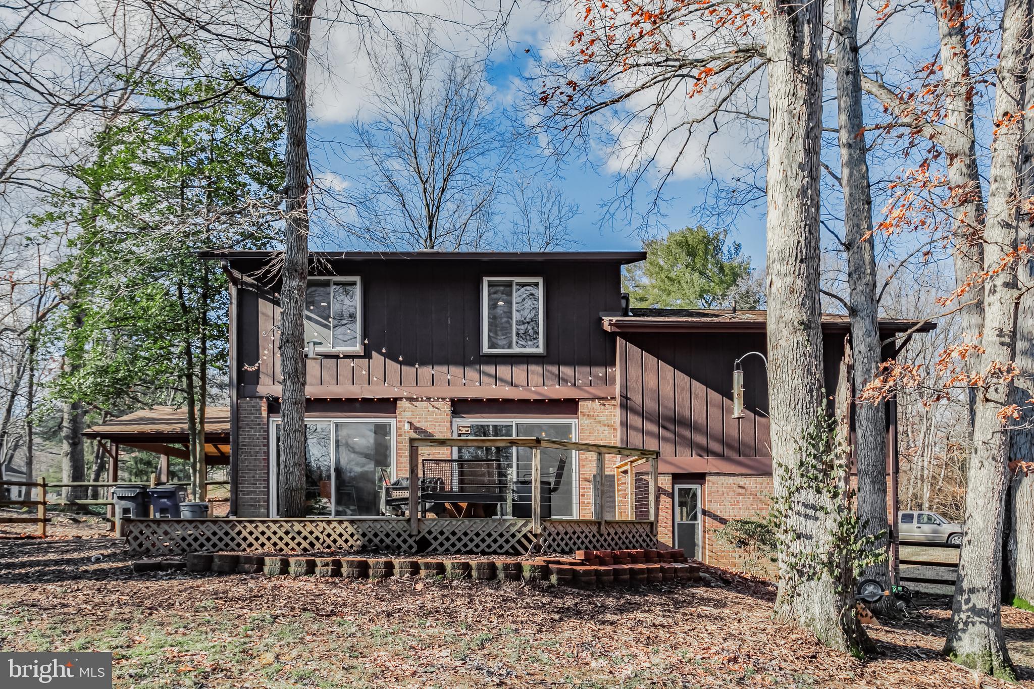 10914 Hunt Club Road Reston, VA 20190 - Photo 2 of 44 a front view of a house with plants