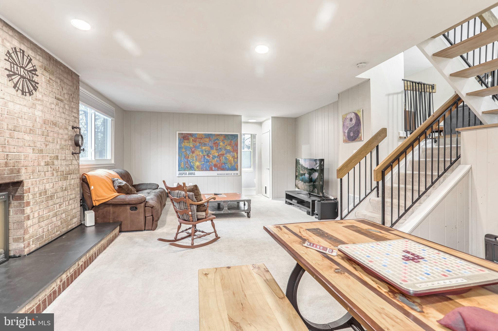 10914 Hunt Club Road Reston, VA 20190 - Photo 24 of 44 a living room with furniture and a fireplace