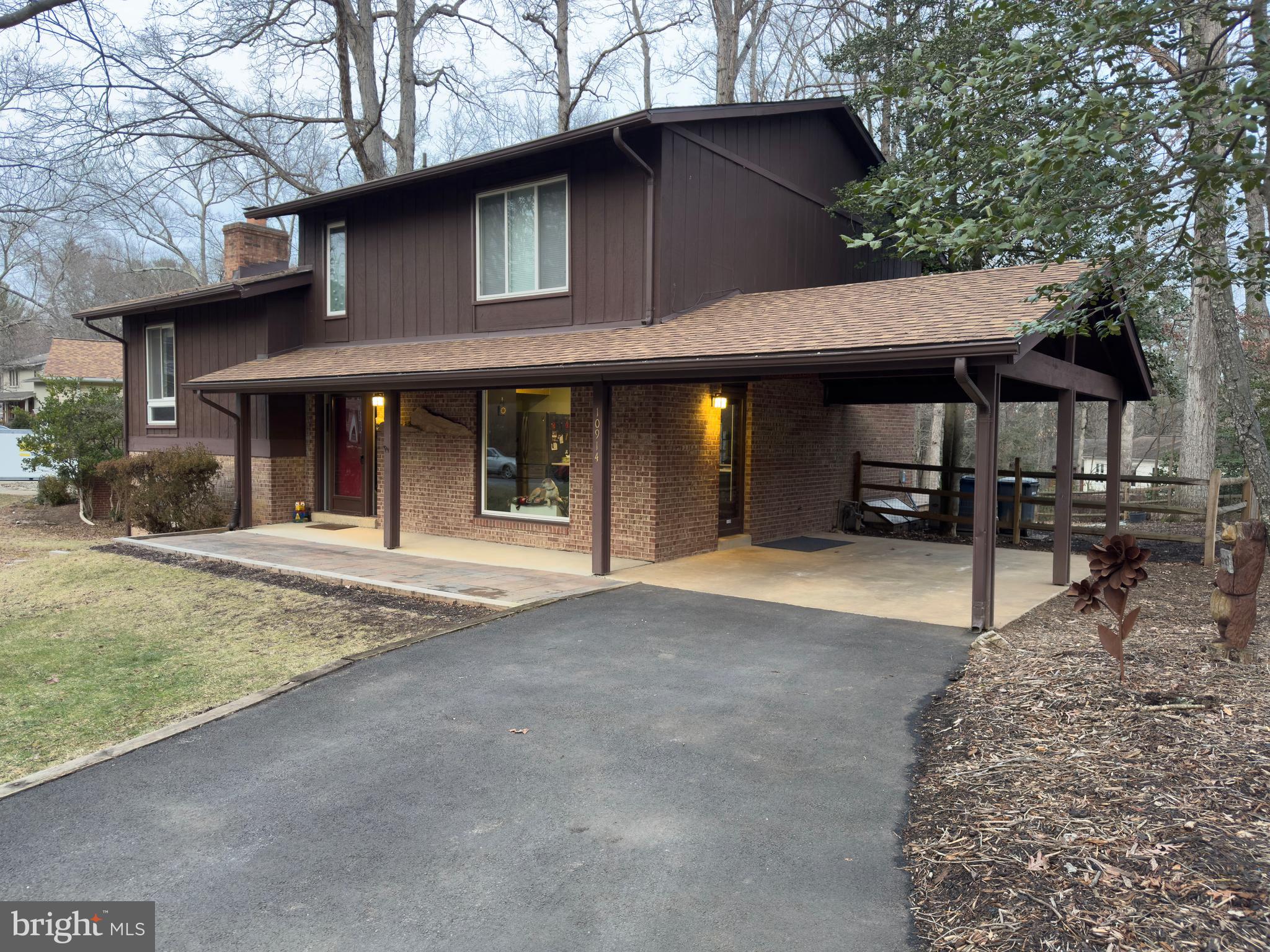 10914 Hunt Club Road Reston, VA 20190 - Photo 35 of 44 a view of a house with backyard and sitting area