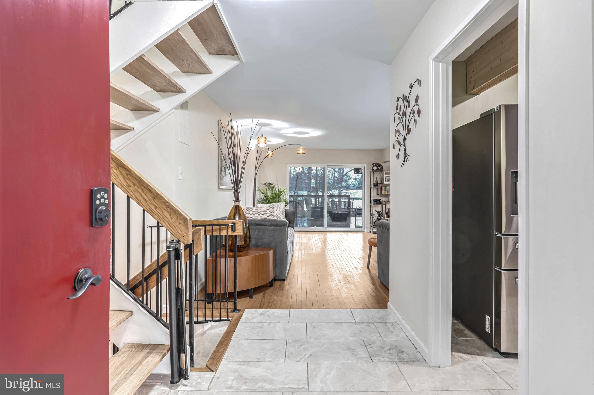 10914 Hunt Club Road Reston, VA 20190 - Photo 4 of 44 a view of entryway and hall with wooden floor