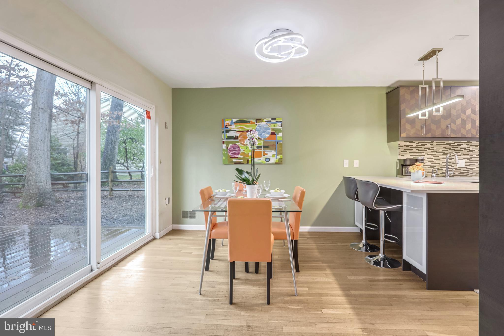 10914 Hunt Club Road Reston, VA 20190 - Photo 8 of 44 a view of a dining room with furniture window and wooden floor