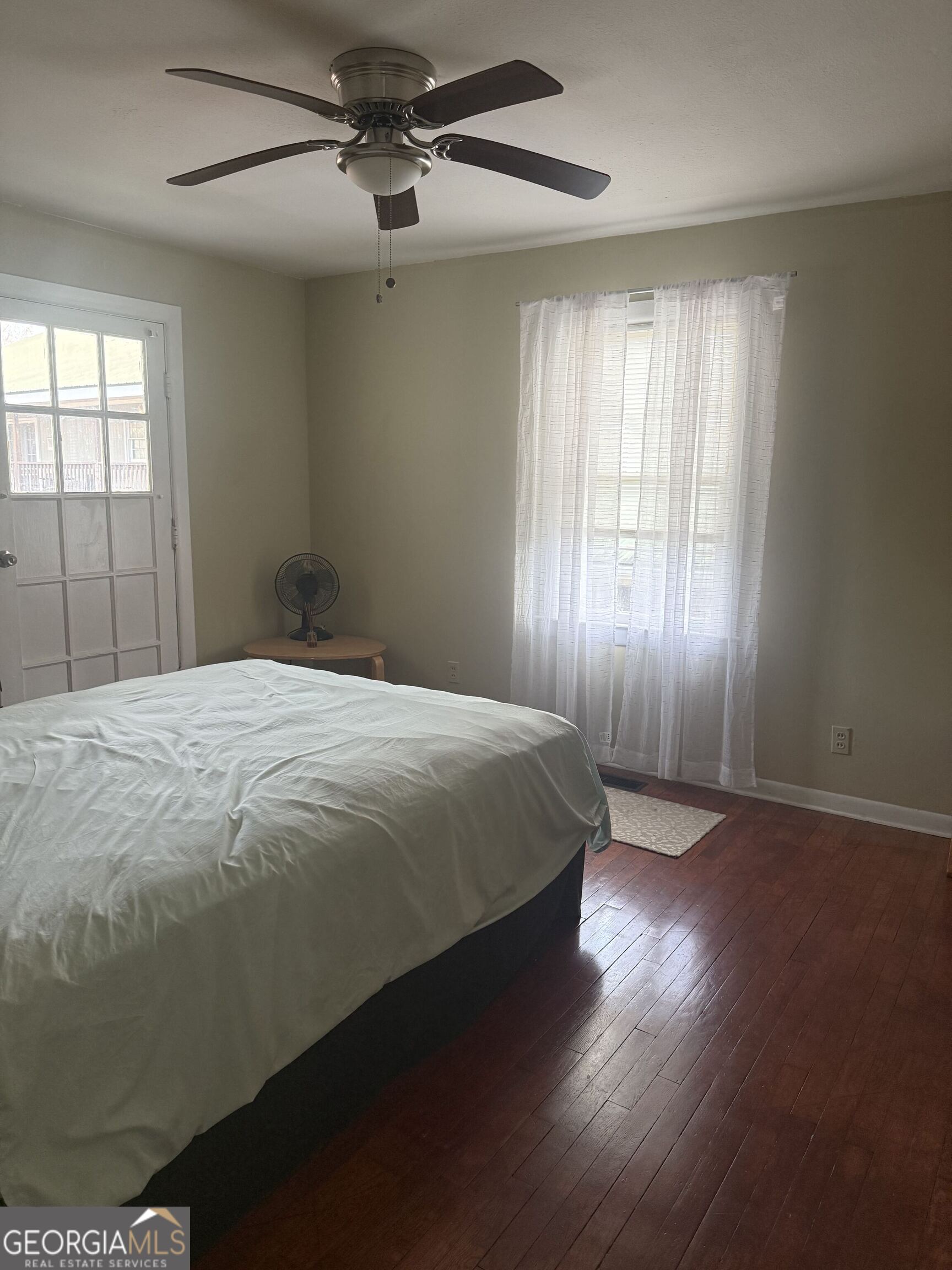 3861 Newnan Road Griffin, GA 30223 - Photo 17 of 89 a spacious bedroom with a bed and a window