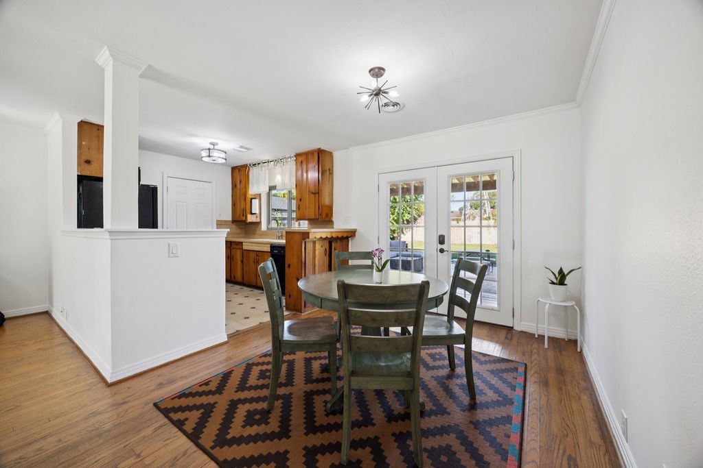 1122 West 31st Street Houston, TX 77018 - Photo 3 of 12 a view of a dining room with furniture and wooden floor