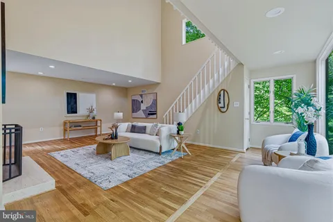 a dining room with furniture and a window
