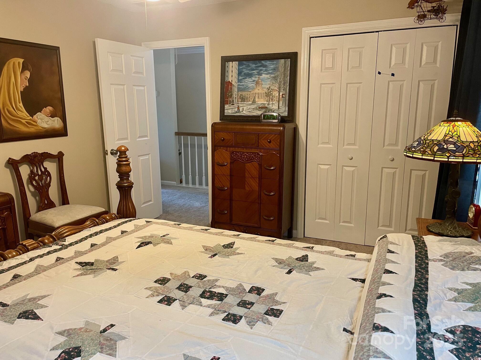 417 Oxford Road Lexington, SC 29072 - Photo 17 of 27 a bedroom with a bed and a dresser