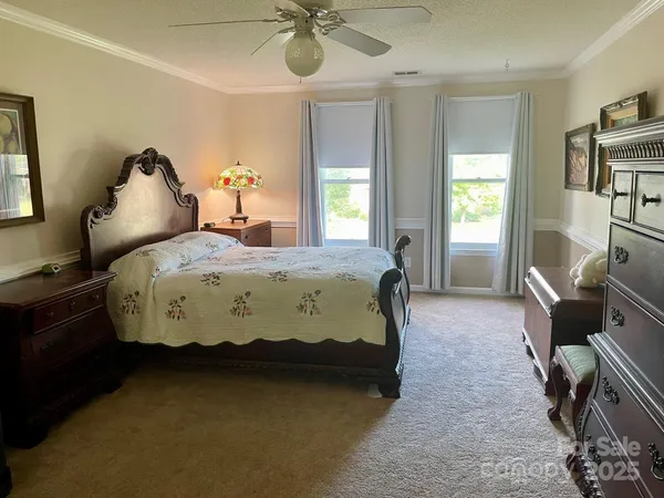 a bed room with a bed and a tv