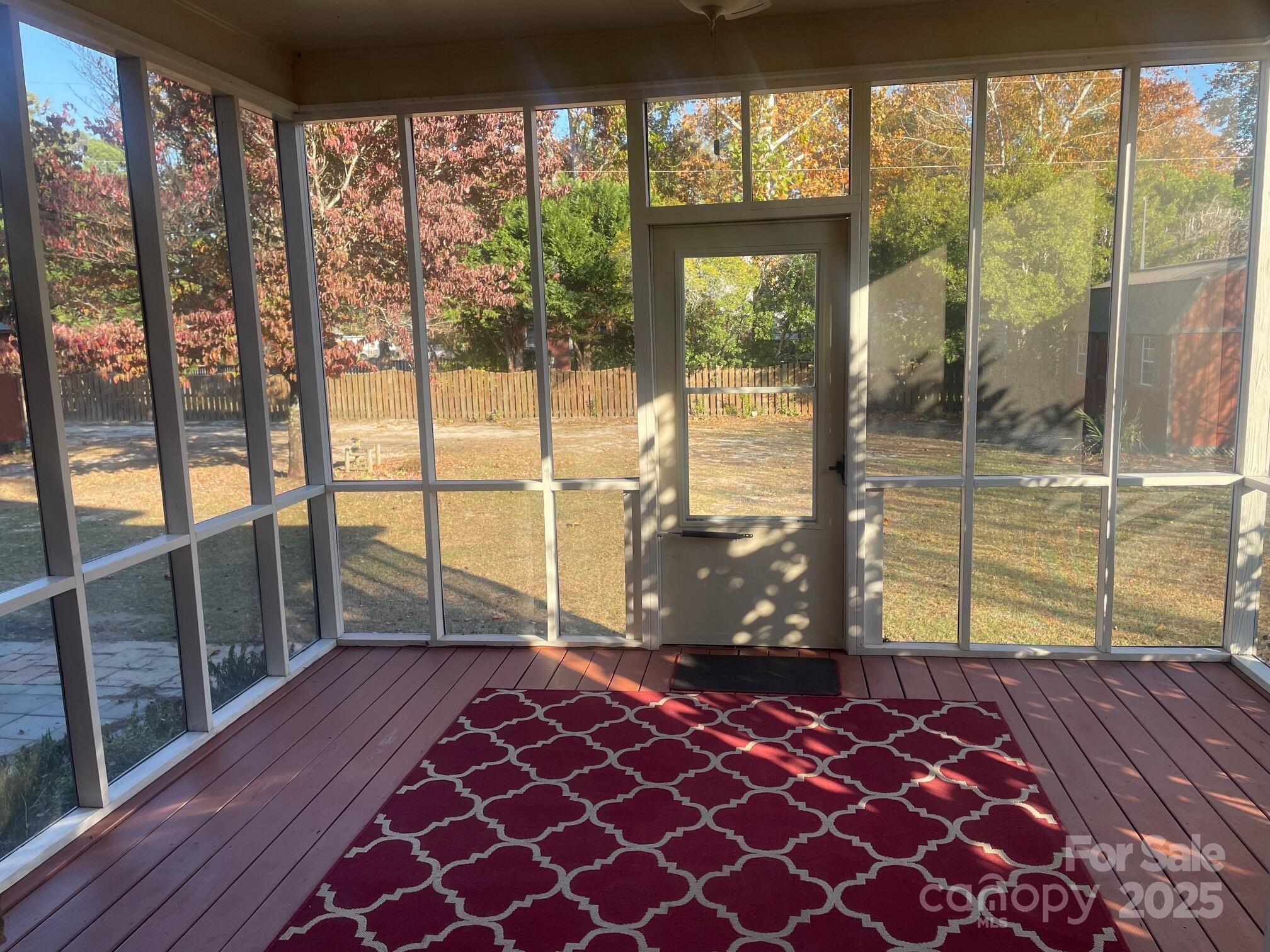 417 Oxford Road Lexington, SC 29072 - Photo 27 of 27 a bedroom with a bed and a lamp next to a window